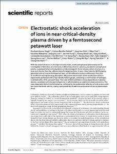 Electrostatic shock acceleration of ions in near-critical-density plasma driven by a femtosecond petawatt laser
