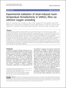 Experimental realization of strain-induced room-temperature ferroelectricity in SrMnO3 films via selective oxygen annealing